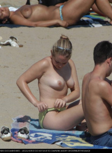 Topless charming chicks sunbathing