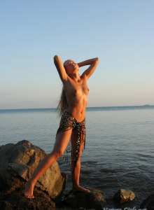 Nature babe posing on the beach