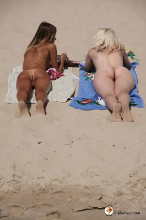 09-naked-teens-rest-on-the-beach